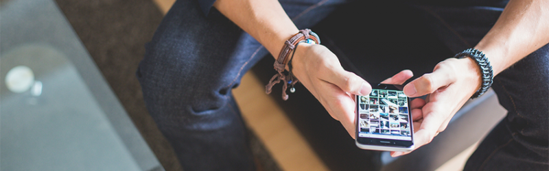 Man using mobile device iPhone